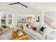 Bright and airy living room with modern furnishings and an open floor plan to the kitchen at 3132 Carol Ave, Charlotte, NC 28208