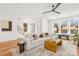 Spacious living room with hardwood floors, large windows, and modern decor at 3132 Carol Ave, Charlotte, NC 28208