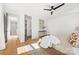 Bright main bedroom with wood floors, ceiling fan, and walk-in closet at 3132 Carol Ave, Charlotte, NC 28208
