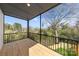 Relaxing screened porch with wooden flooring and scenic views of the surrounding landscape at 3132 Carol Ave, Charlotte, NC 28208