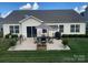 Backyard patio complete with a dining set and BBQ, ideal for outdoor living and entertaining at 3134 Sterling Ct, Fort Mill, SC 29707