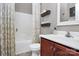 Bathroom featuring modern vanity, toilet, tub with shower, and decorative shelves for organized storage at 3134 Sterling Ct, Fort Mill, SC 29707