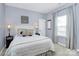 Well-lit bedroom featuring a cozy bed, side tables with lamps, neutral walls, and a bright window at 3134 Sterling Ct, Fort Mill, SC 29707