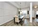 Elegant dining area featuring wainscoting, modern lighting, and a stylish table set at 3134 Sterling Ct, Fort Mill, SC 29707