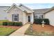 Inviting entryway with neatly landscaped shrubbery and a cute pineapple statue at 3134 Sterling Ct, Fort Mill, SC 29707