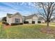 Charming one-story home with a well-manicured lawn and mature tree at 3134 Sterling Ct, Fort Mill, SC 29707