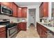 Cozy kitchen with granite countertops, stainless steel appliances, and cherry wood cabinets at 3134 Sterling Ct, Fort Mill, SC 29707