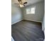 Cozy bedroom with gray walls, wood-look floors, and a window with natural light at 317 Echodale Dr, Charlotte, NC 28217