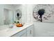 Bright bathroom with a modern vanity, double sinks, and stylish dandelion artwork at 4626 Harris Elliot Rd, Lincolnton, NC 28092