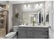 Bathroom featuring a double sink vanity, walk-in shower, and neutral color palette at 5025 Macvittie Ln, Charlotte, NC 28214