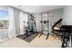 Home exercise room with light gray walls, carpet, machines, weights, and natural light at 5025 Macvittie Ln, Charlotte, NC 28214