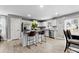 Modern kitchen with stainless steel appliances, granite countertops, and a breakfast bar at 5025 Macvittie Ln, Charlotte, NC 28214