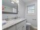 Bright bathroom features white cabinetry, granite countertop, and a framed mirror at 503 Brookfield Cir # 1, Salisbury, NC 28146