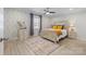 Bright bedroom featuring a patterned accent wall, wooden bed frame, and neutral bedding at 503 Brookfield Cir # 1, Salisbury, NC 28146