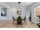 Well-lit dining area with a round glass table and contemporary artwork at 503 Brookfield Cir # 1, Salisbury, NC 28146