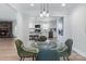 Elegant dining area with glass table, pendant lighting, and a view into the modern kitchen creating an inviting space at 503 Brookfield Cir # 1, Salisbury, NC 28146