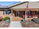 Charming brick front porch adorned with flowers and furniture, offering a welcoming entrance at 503 Brookfield Cir # 1, Salisbury, NC 28146