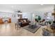 Bright living room with wood floors, a ceiling fan, a leather sofa, and large windows at 503 Brookfield Cir # 1, Salisbury, NC 28146