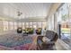 Bright sunroom with floor-to-ceiling windows, comfortable seating, and a colorful accent rug at 503 Brookfield Cir # 1, Salisbury, NC 28146