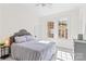 Bright bedroom featuring soft carpet, a queen bed, and natural light at 506 S Church St, Salisbury, NC 28144