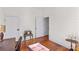 Bedroom with hardwood floors, white walls and vintage furniture at 506 S Church St, Salisbury, NC 28144