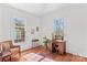 Bedroom features hardwood floors, natural light, and a writing desk at 506 S Church St, Salisbury, NC 28144