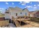 Backyard view of a quaint two-story home with a lovely wooden deck at 506 S Church St, Salisbury, NC 28144