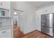 Spacious kitchen leading to the dining room, features stainless steel appliances, and hardwood floors at 506 S Church St, Salisbury, NC 28144