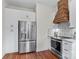 Bright kitchen with stainless steel appliances and white cabinets at 506 S Church St, Salisbury, NC 28144