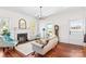 Inviting living room features hardwood floors, fireplace, elegant lighting at 506 S Church St, Salisbury, NC 28144