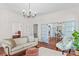 Elegant living room showcases hardwood floors, neutral decor, and French door access to dining area and other rooms at 506 S Church St, Salisbury, NC 28144