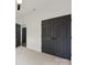 Bedroom with neutral carpet and black paneled closet doors at 529 Veloce Trl, Fort Mill, SC 29715