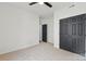 Bright bedroom with neutral carpet, white walls, ceiling fan, and black doors at 529 Veloce Trl, Fort Mill, SC 29715