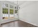 Bright dining area with large windows and elegant dark wood floors at 529 Veloce Trl, Fort Mill, SC 29715