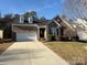 Charming brick home with dormer windows and attached two car garage at 529 Veloce Trl, Fort Mill, SC 29715