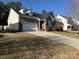 Well-maintained house with dark shingle roof, brick accents, and 2-car garage at 529 Veloce Trl, Fort Mill, SC 29715