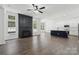 Bright living room with a modern fireplace, hardwood floors, and ample natural light at 529 Veloce Trl, Fort Mill, SC 29715