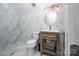 Modern bathroom with marble tile and a floating vanity at 5645 White Store Rd, Wingate, NC 28174