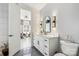 Bathroom with white vanity, gray tile floors, and view to sitting area at 5645 White Store Rd, Wingate, NC 28174