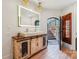 Basement bathroom with rustic vanity and access to backyard at 5645 White Store Rd, Wingate, NC 28174