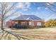 Brick house with large deck, professionally landscaped yard at 5645 White Store Rd, Wingate, NC 28174