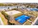 Aerial view of the neighborhood amenities: beach volleyball, basketball court, playground and pool at 5826 Castlecove Rd, Charlotte, NC 28273