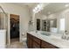 The primary bathroom includes a double sink vanity, large mirrors, and a walk-in closet at 5826 Castlecove Rd, Charlotte, NC 28273