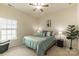 Cozy bedroom with a ceiling fan and large windows, offering a comfortable retreat at 5826 Castlecove Rd, Charlotte, NC 28273