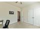 Bedroom featuring a ceiling fan, closet and a door leading to another room at 5826 Castlecove Rd, Charlotte, NC 28273