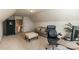 Bonus room with a couch and desk at 5826 Castlecove Rd, Charlotte, NC 28273