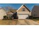 Charming single-Gathering home with a well-manicured front yard and a two-car garage, perfect for suburban living at 5826 Castlecove Rd, Charlotte, NC 28273