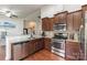 Well-equipped kitchen with stainless steel appliances, granite countertops, and ample cabinet space for storage at 5826 Castlecove Rd, Charlotte, NC 28273