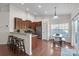 Bright eat-in kitchen features granite counters, stainless appliances, and wood cabinets, perfect for cooking and gathering at 5826 Castlecove Rd, Charlotte, NC 28273