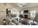 Spacious living room that seamlessly integrates with the kitchen with a large fireplace at 5826 Castlecove Rd, Charlotte, NC 28273